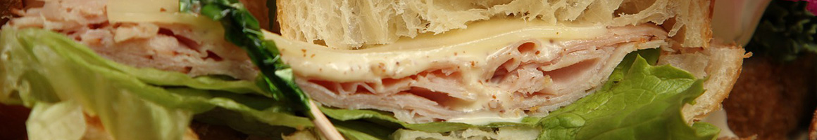 Eating Sandwich Cafe at Madison Cheese Shop & Cafe restaurant in Madison, CT.